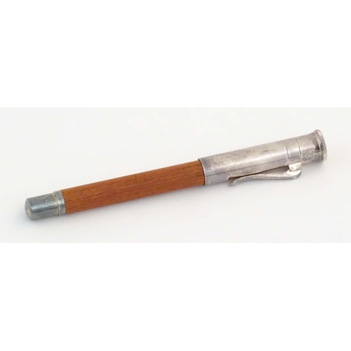 1157 - A cased Graf von Faber-Castell ballpoint pen, with reeded hardwood grip and articulated clip. Approx... 