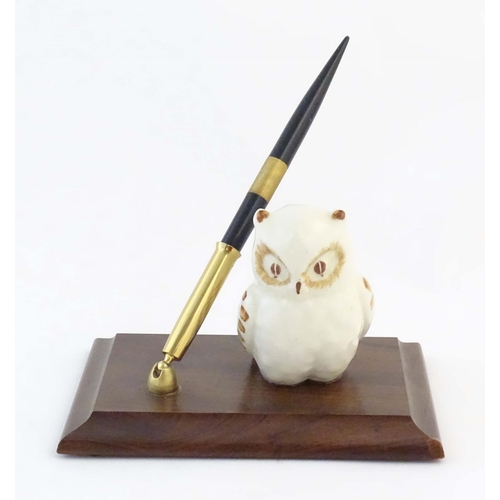 1161 - A late 20th / early 21stC pen holder with ceramic owl on a wooden base. Approx. 6