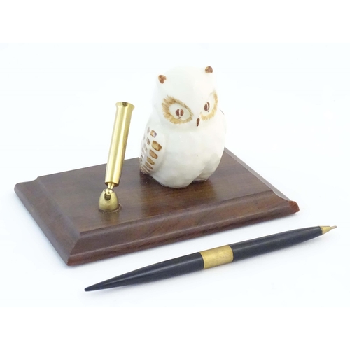 1161 - A late 20th / early 21stC pen holder with ceramic owl on a wooden base. Approx. 6