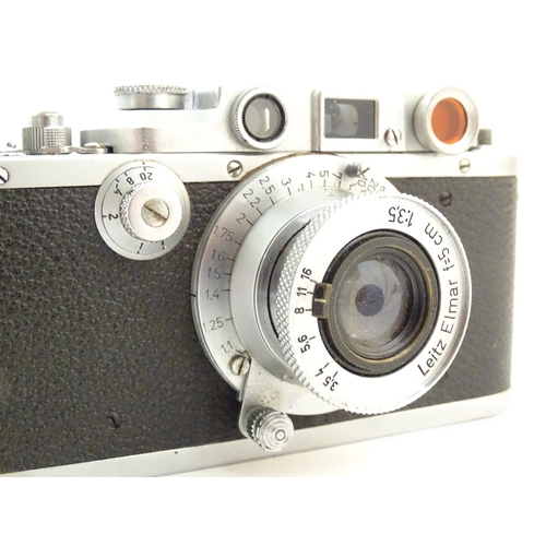 1162 - A c1930s cased Leica 3B 50mm film camera, serial number 346728, fitted with an Leitz Elmar f=5cm len... 