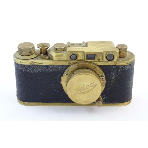 1164 - A mid 20thC Russian copy 'Leica II(D) Olympiada' 35mm film camera, in gilt finish and leather case, ... 