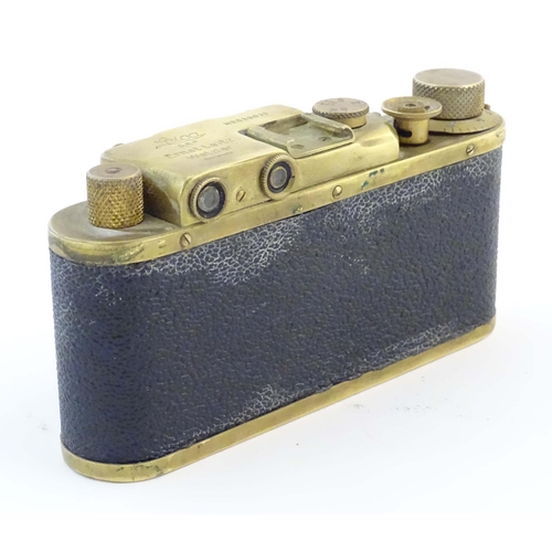 1164 - A mid 20thC Russian copy 'Leica II(D) Olympiada' 35mm film camera, in gilt finish and leather case, ... 