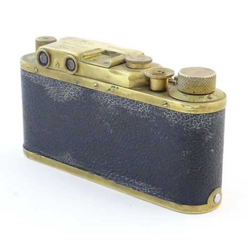 1164 - A mid 20thC Russian copy 'Leica II(D) Olympiada' 35mm film camera, in gilt finish and leather case, ... 