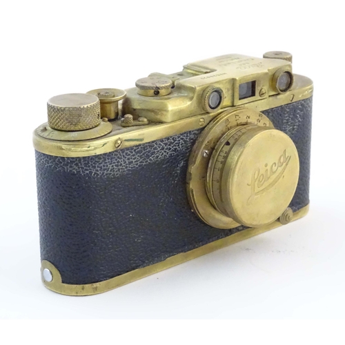 1164 - A mid 20thC Russian copy 'Leica II(D) Olympiada' 35mm film camera, in gilt finish and leather case, ... 