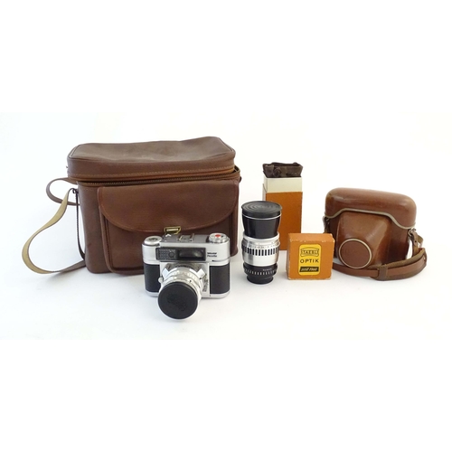 1165 - A quantity of 20thC film cameras and equipment, comprising: a Canon 8-2 cinecamera, a cased Braun Pa... 