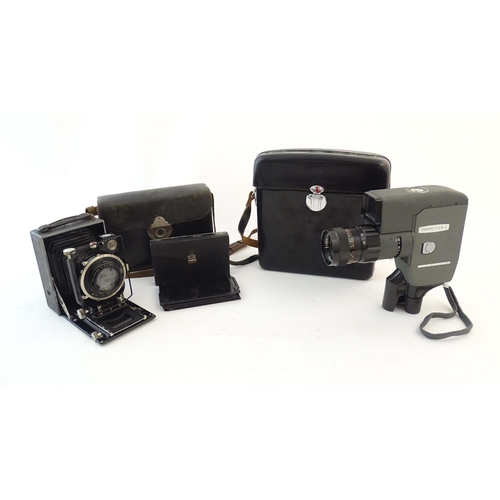 1165 - A quantity of 20thC film cameras and equipment, comprising: a Canon 8-2 cinecamera, a cased Braun Pa... 