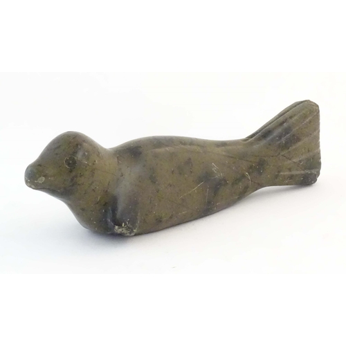 1172 - A 20thC Canadian Inuit carved soapstone model of a seal. Approx. 13 1/2