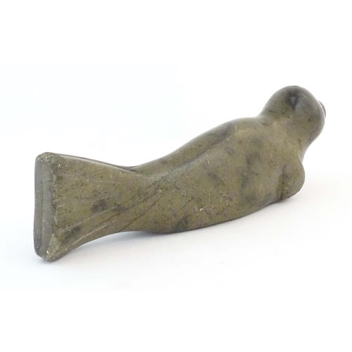 1172 - A 20thC Canadian Inuit carved soapstone model of a seal. Approx. 13 1/2