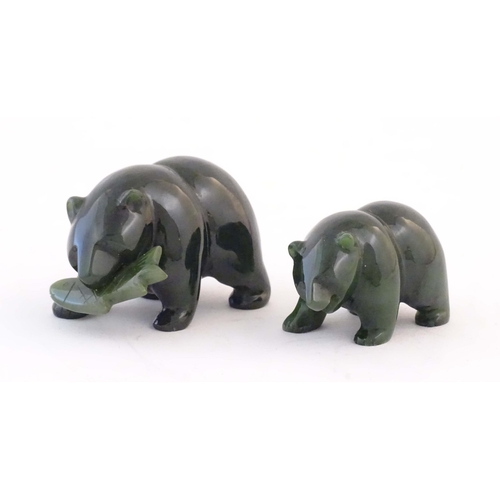 1173 - Two carved jade coloured hardstone models of bears, one with a fish in its mouth. Largest approx. 2 ... 