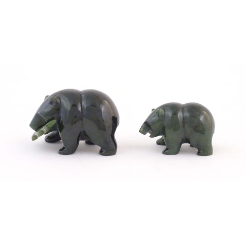 1173 - Two carved jade coloured hardstone models of bears, one with a fish in its mouth. Largest approx. 2 ... 