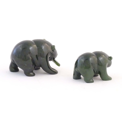 1173 - Two carved jade coloured hardstone models of bears, one with a fish in its mouth. Largest approx. 2 ... 