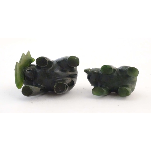 1173 - Two carved jade coloured hardstone models of bears, one with a fish in its mouth. Largest approx. 2 ... 