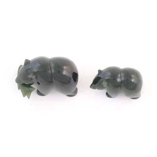 1173 - Two carved jade coloured hardstone models of bears, one with a fish in its mouth. Largest approx. 2 ... 