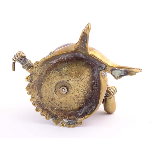 1187 - An early 20thC novelty brass and coconut inkwell modelled as a seated man wearing a plume hat. Appro... 