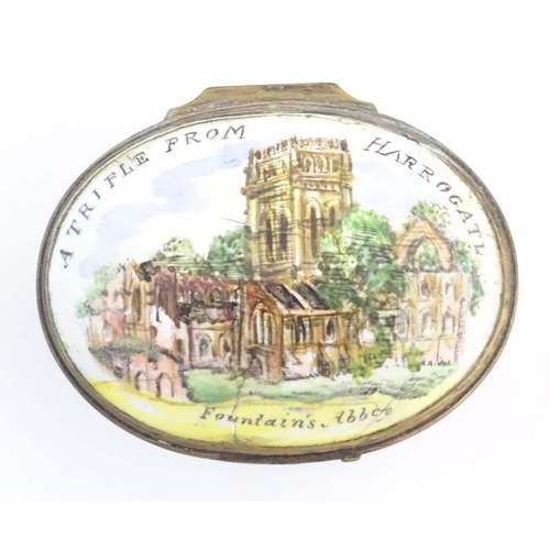 1204 - A 19thC Bilston / Battersea enamel pill box of oval form, the lid decorated with a hand painted view... 