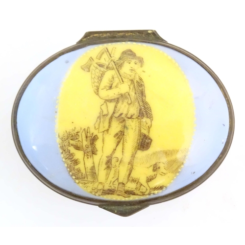 1205 - A 19thC Bilston / Battersea enamel patch box of oval form, the lid decorated with a huntsman and his... 