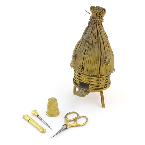 1223 - A 19thC gilt metal novelty sewing / needlework necessaire / etui modelled as beehive / skep with a s... 