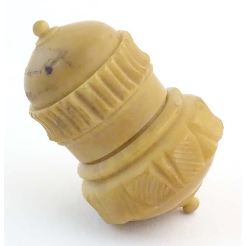 1225 - A Victorian carved coquilla nut sewing / thimble case modelled as a stylised acorn. Approx. 2 1/4