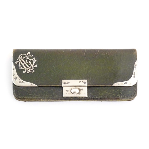 1229 - A Victorian green leather purse of rectangular form retailed by Mappin Brothers, 66 Cheapside, with ... 