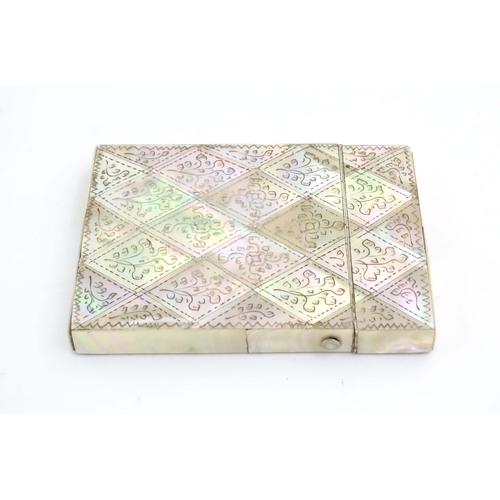 1230 - A Victorian mother of pearl card case with floral and foliate decoration. Approx. 4