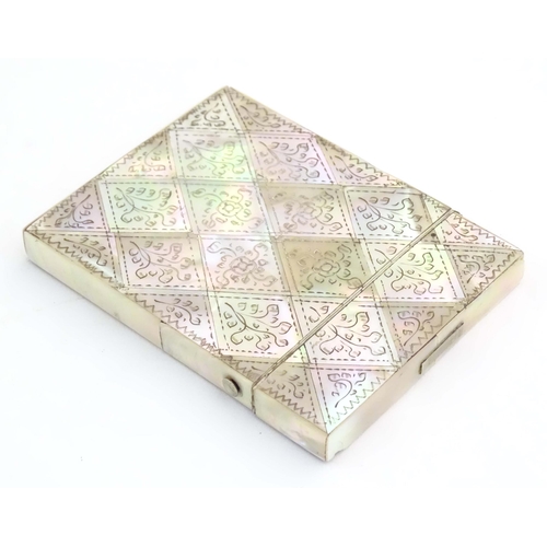 1230 - A Victorian mother of pearl card case with floral and foliate decoration. Approx. 4