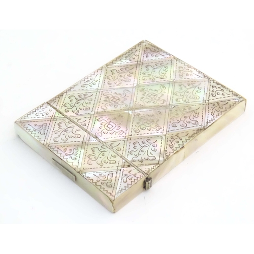 1230 - A Victorian mother of pearl card case with floral and foliate decoration. Approx. 4