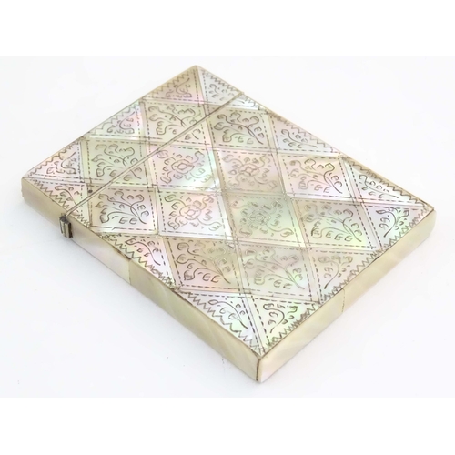 1230 - A Victorian mother of pearl card case with floral and foliate decoration. Approx. 4