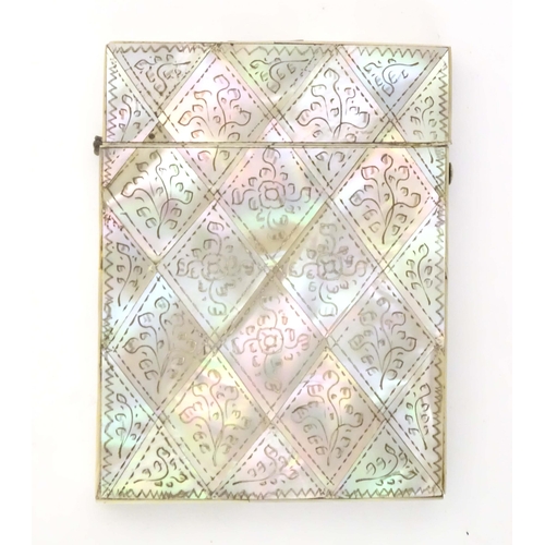 1230 - A Victorian mother of pearl card case with floral and foliate decoration. Approx. 4