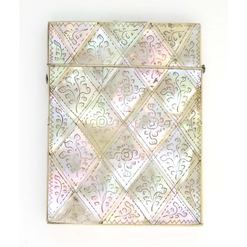 1230 - A Victorian mother of pearl card case with floral and foliate decoration. Approx. 4