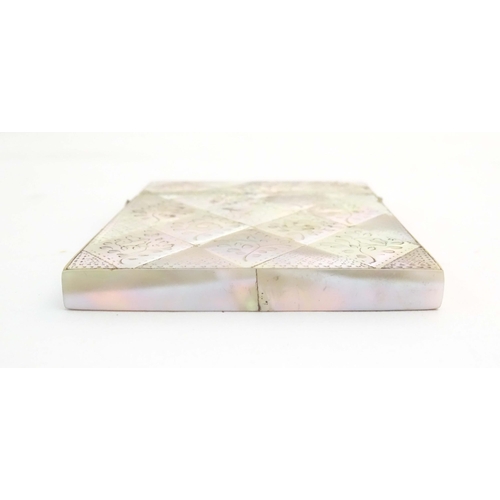 1231 - A Victorian mother of pearl card case with floral and foliate decoration. Approx. 4