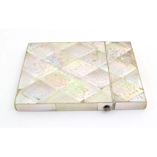 1231 - A Victorian mother of pearl card case with floral and foliate decoration. Approx. 4