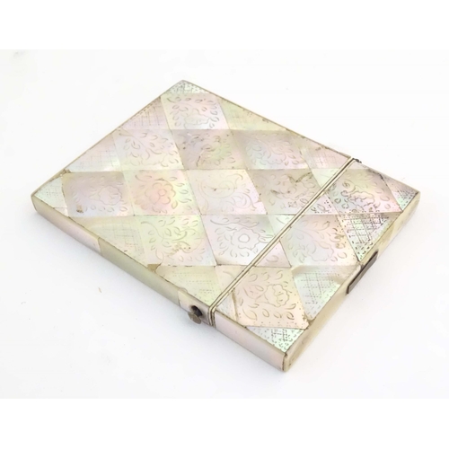 1231 - A Victorian mother of pearl card case with floral and foliate decoration. Approx. 4