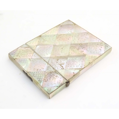 1231 - A Victorian mother of pearl card case with floral and foliate decoration. Approx. 4