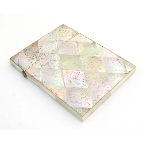 1231 - A Victorian mother of pearl card case with floral and foliate decoration. Approx. 4