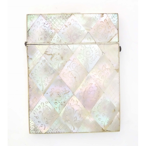 1231 - A Victorian mother of pearl card case with floral and foliate decoration. Approx. 4