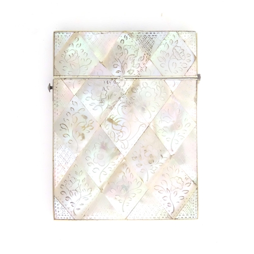 1231 - A Victorian mother of pearl card case with floral and foliate decoration. Approx. 4