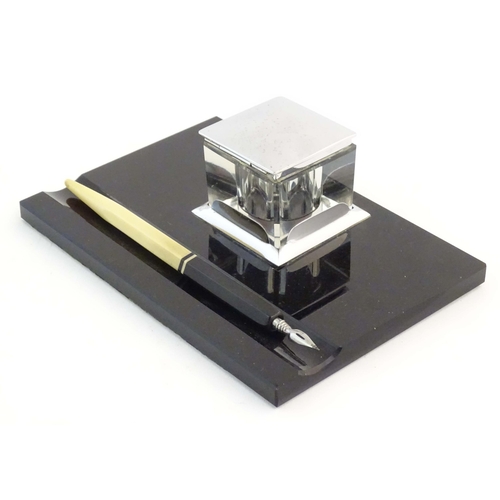 1240 - A German Art Deco standish / inkstand with central glass inkwell of square form and dipping pen. Ink... 