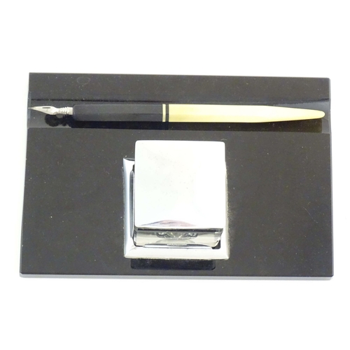 1240 - A German Art Deco standish / inkstand with central glass inkwell of square form and dipping pen. Ink... 