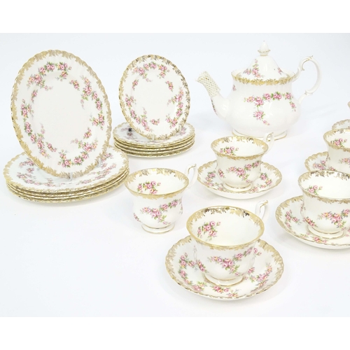 210 - A quantity of Royal Albert tea wares in the Dimity Rose pattern to include teapot, tea cups and sauc... 