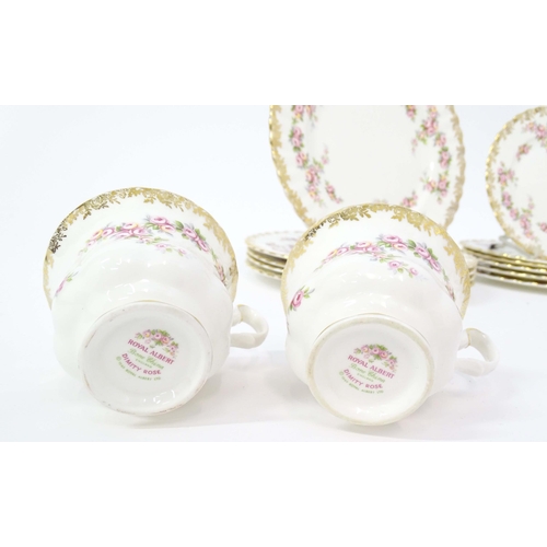 210 - A quantity of Royal Albert tea wares in the Dimity Rose pattern to include teapot, tea cups and sauc... 