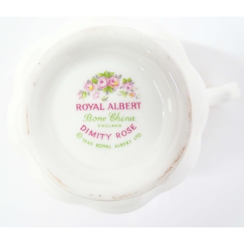 210 - A quantity of Royal Albert tea wares in the Dimity Rose pattern to include teapot, tea cups and sauc... 