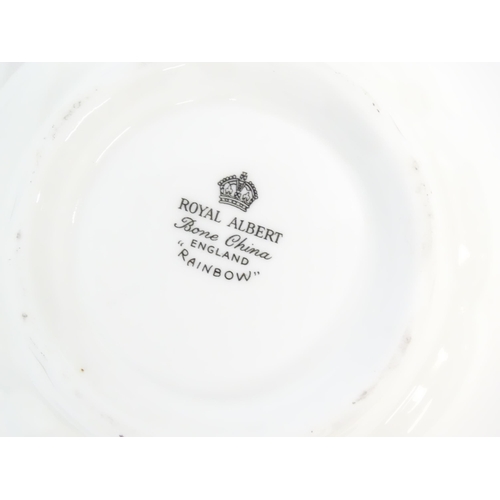 211 - A quantity of Royal Albert tea wares in the Rainbow pattern to include tea cups and saucers, milk ju... 