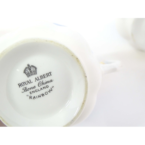 211 - A quantity of Royal Albert tea wares in the Rainbow pattern to include tea cups and saucers, milk ju... 