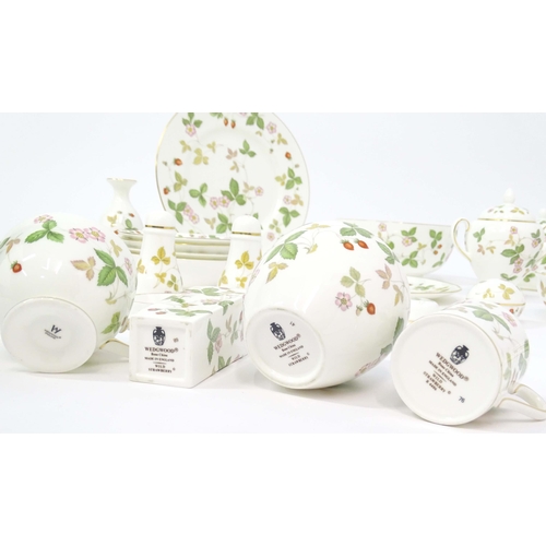 213 - A quantity of Wedgwood tea and dinner wares in the Wild Strawberry pattern, to include plates, teapo... 