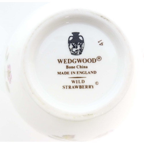 213 - A quantity of Wedgwood tea and dinner wares in the Wild Strawberry pattern, to include plates, teapo... 