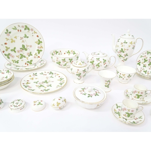 213 - A quantity of Wedgwood tea and dinner wares in the Wild Strawberry pattern, to include plates, teapo... 