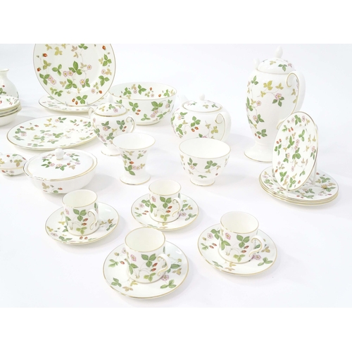 213 - A quantity of Wedgwood tea and dinner wares in the Wild Strawberry pattern, to include plates, teapo... 