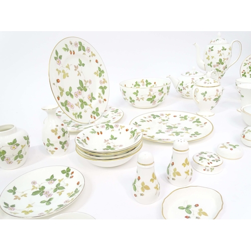 213 - A quantity of Wedgwood tea and dinner wares in the Wild Strawberry pattern, to include plates, teapo... 