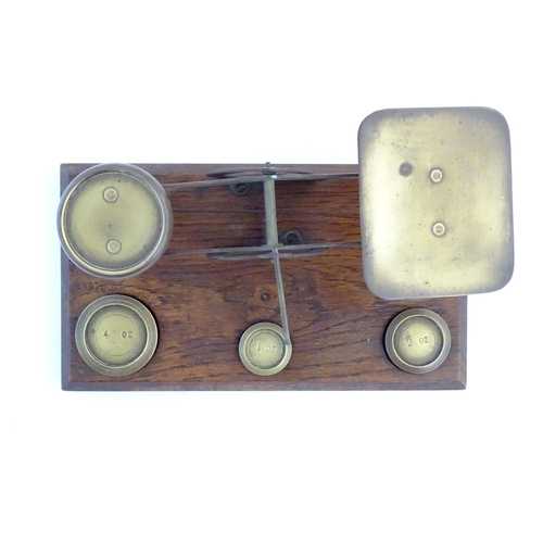 1251 - A late Victorian pair of postage scales, stamped 'Warranted Accurate', of brass construction and aff... 