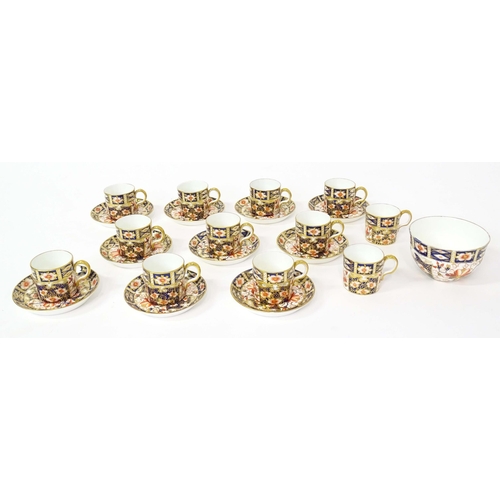 157 - A quantity of Royal Crown Derby coffee cups, saucers, and a sugar bowl decorated in the Imari palett... 